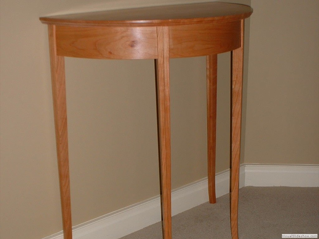 Cherry half-round table, for auction at an SOS Gala